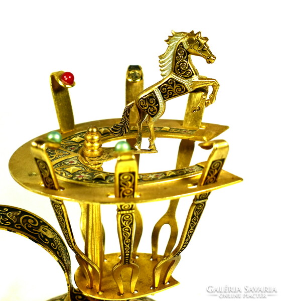 Small fork set with Spanish snacks on a equestrian figure stand