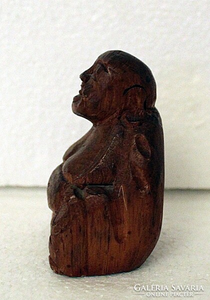 Small carved wooden Buddha statue