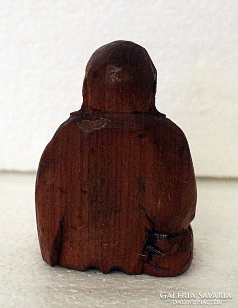 Small carved wooden Buddha statue