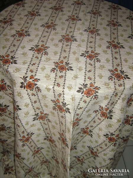A huge woven tablecloth with a beautiful floral pattern, new