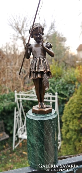 The girl caught a fish - bronze statue