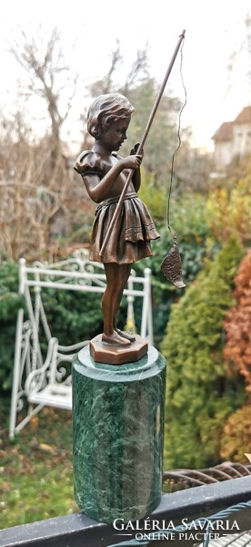 The girl caught a fish - bronze statue