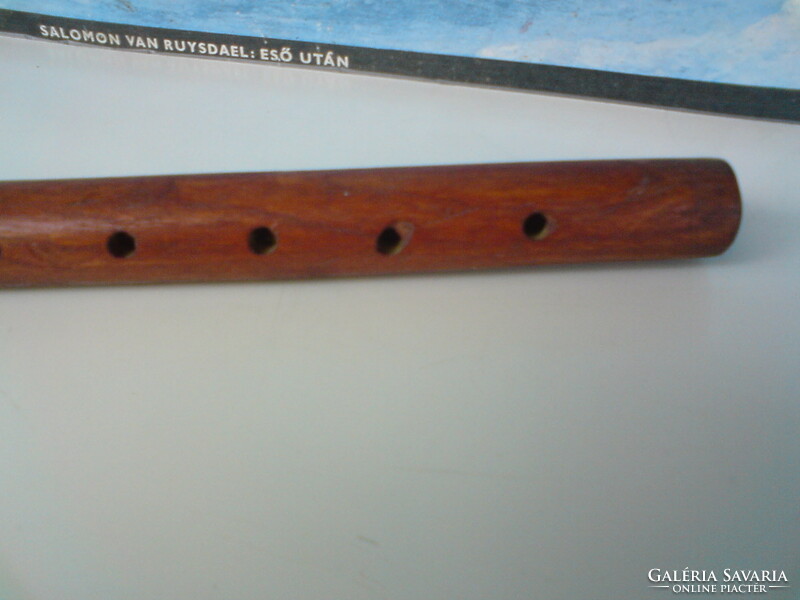 Old hand-carved toy flute