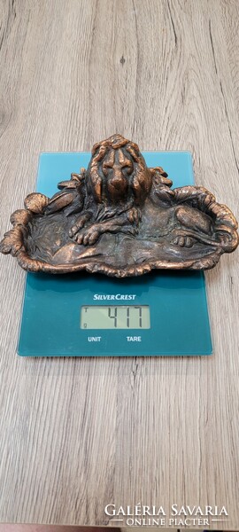 Lion letter weight or business card holder.