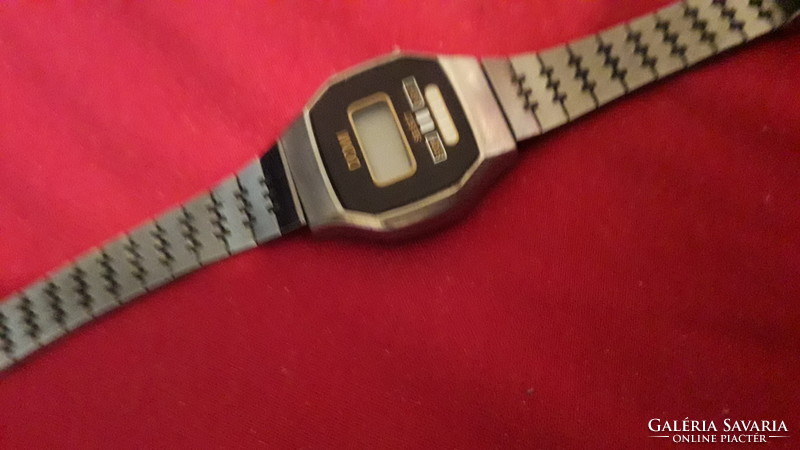 Domi quartz women's wristwatch from an old socialist era with untested steel strap as shown in the pictures