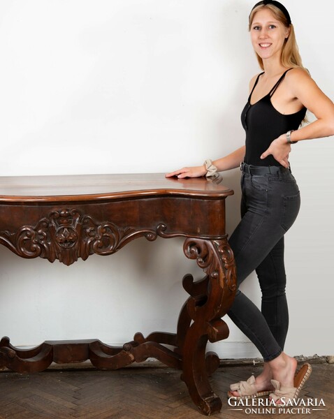 Carved wooden console table in neo-baroque style