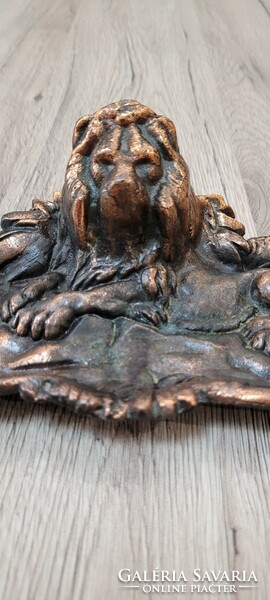Lion letter weight or business card holder.