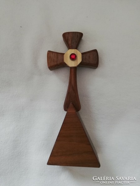 Wooden cross with a ruby-colored stone