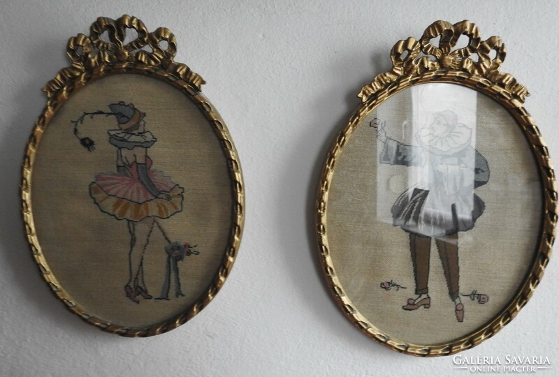Pair of antique tapestries in an oval frame