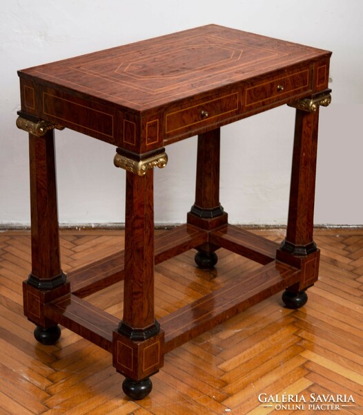 Inlaid chest of drawers with stylized pillar legs