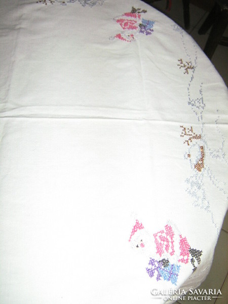 Beautiful cross-stitch hand-embroidered white winter tablecloth with Santa Claus