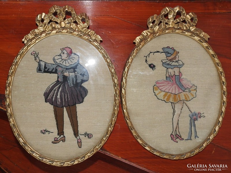 Pair of antique tapestries in an oval frame