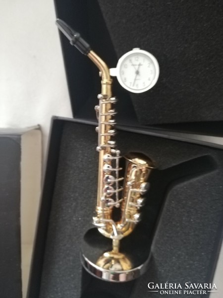Ornamental clock depicting a vintage saxophone in its original box with citizen mechanism