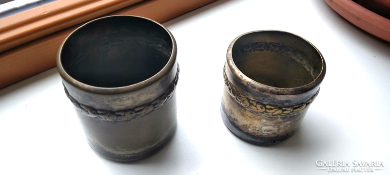 Two copper-plated, metal holders in pairs