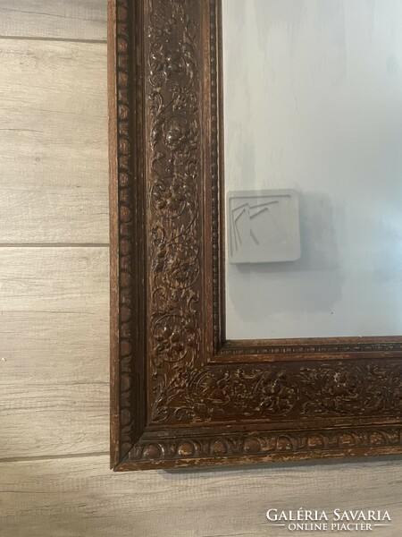 Antique mirror with carved frame.