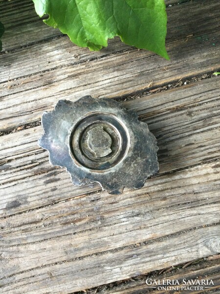 A beautiful metal pedestal with small buds