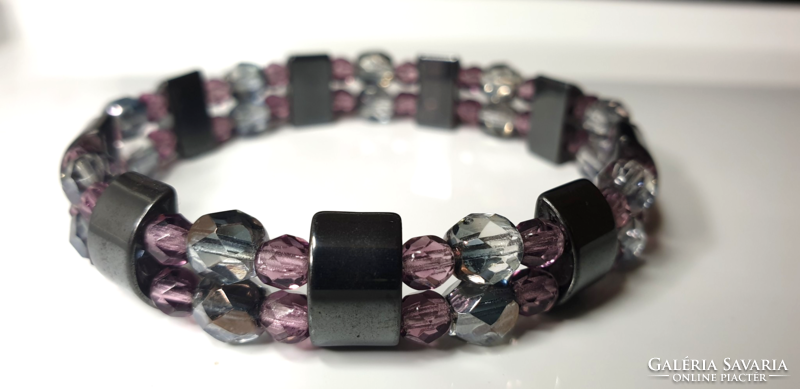 Hematite bracelet with polished glass beads in smoke and purple.