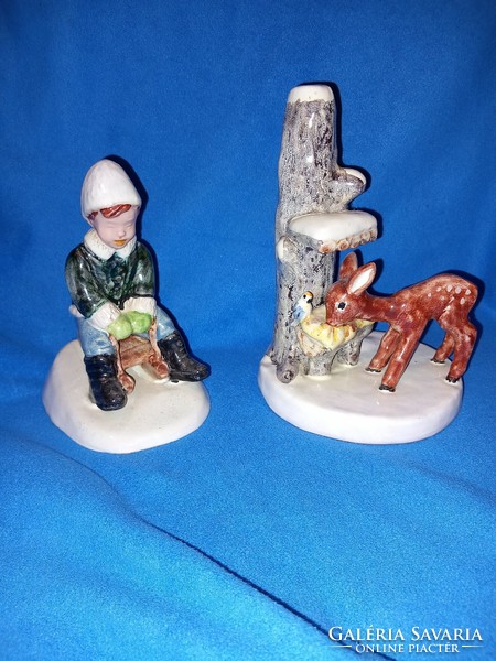 2 Izsépy ceramic figurines of a boy sledding and a deer at the feeder