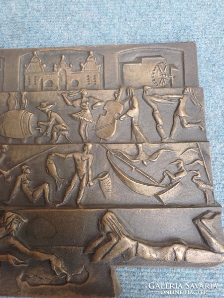 A rare balaton bronze relief, scene of danger creation