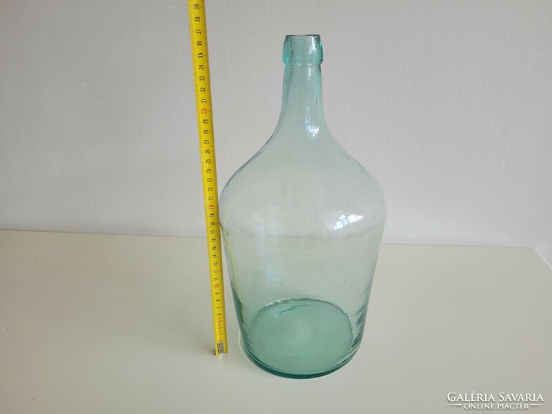 Old large size 5 liter turquoise green huta glass bottle with conical bottom balloon bottle