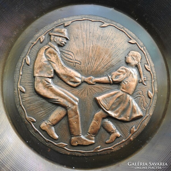 Bronzed iron wall plate - wall plate - with a folk dance pattern