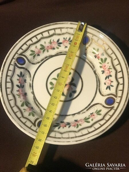 A large cup and two matching smaller plates
