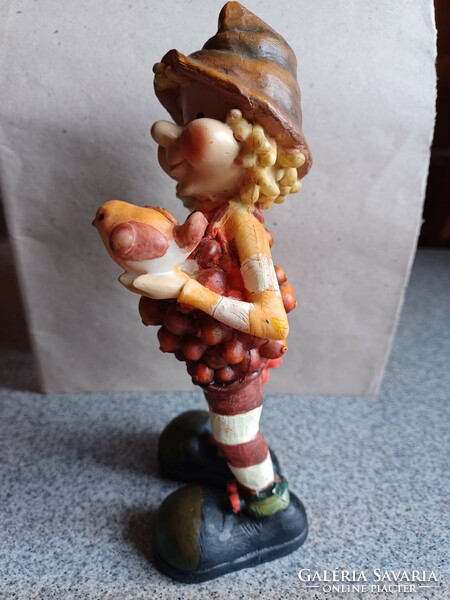 Polyresin figure, boy with bird.