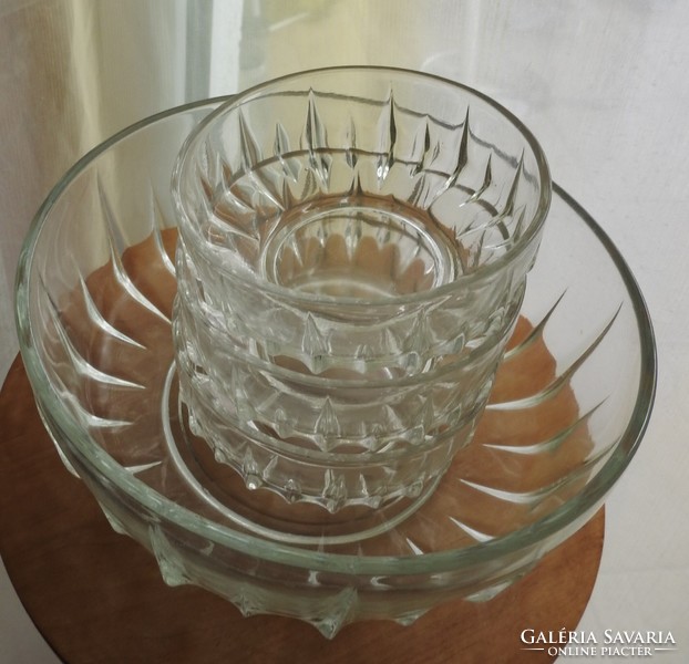 A huge glass bowl with small bowls