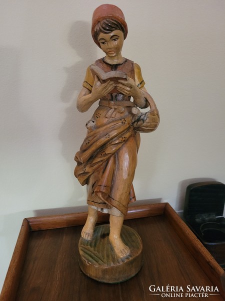 Antique old painted wooden statue