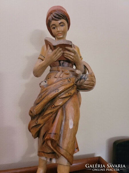 Antique old painted wooden statue