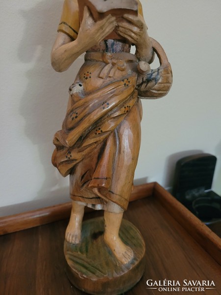 Antique old painted wooden statue