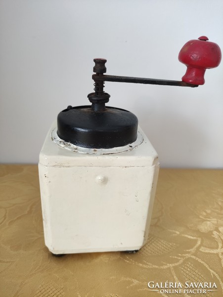 Old manual coffee grinder with drawers