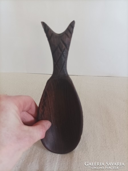 Carved wooden spoon in the shape of a pineapple, dark brown