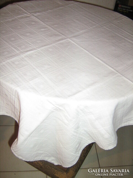 Beautiful antique snow-white checkered damask tablecloth