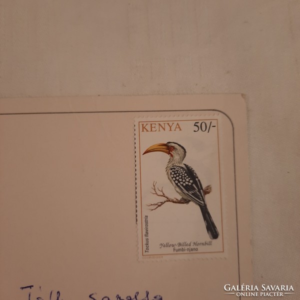 Postcard from Nairobi with stamp 1999. Year postal clerk