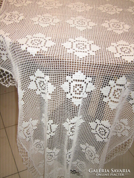 Beautiful snow-white filigree hand-crocheted antique floral lace tablecloth