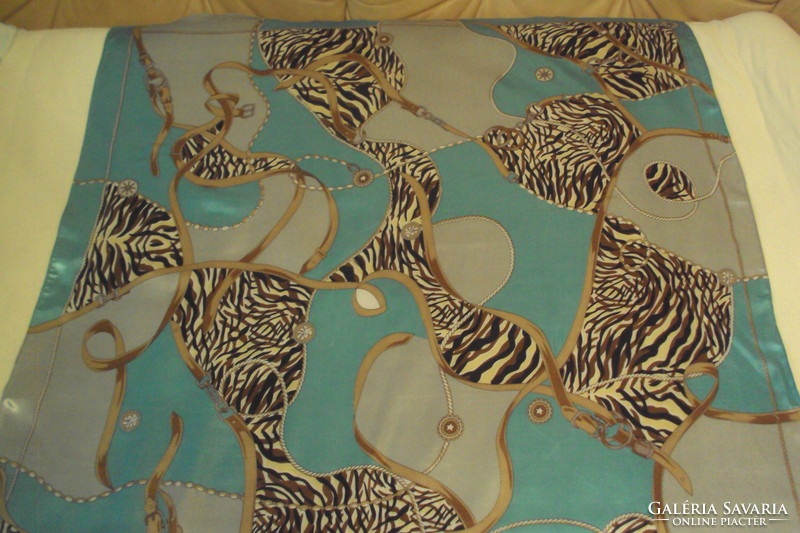 Brand new large size, elegant fine silk scarf with a special pattern on a turquoise base.