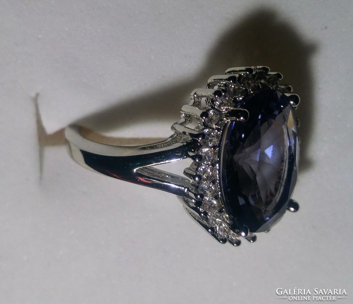 Silver blue sapphire stone ring decorated with zircon stones