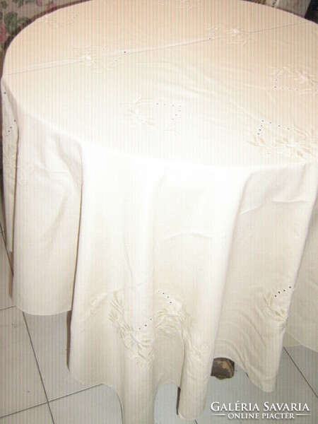 Beautiful hand-embroidered elegant cream-colored tablecloth