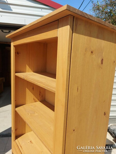 A shelf made of acacia wood with metal handles and hinges is for sale.