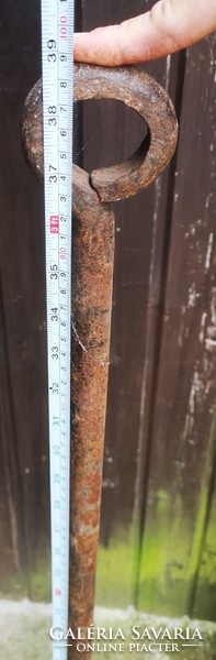 Antique wooden mortar with wrought iron hammer 1800s folk museum-type object. Crop seeds