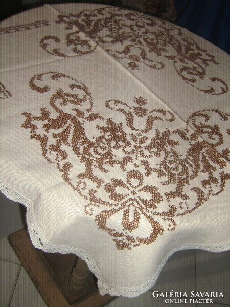 Beautiful, richly hand-embroidered cross-stitch woven tablecloth with a lace edge
