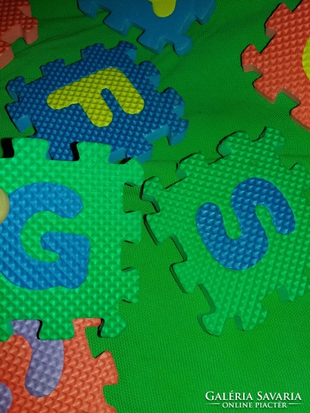 Retro sponge puzzle pieces with many letters to fill gaps as shown in the pictures