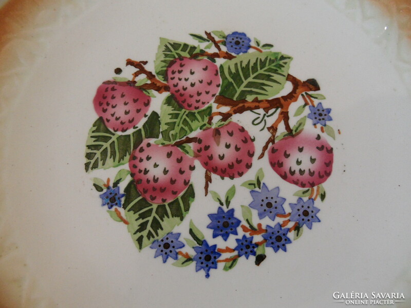 Older granite strawberry wall plate