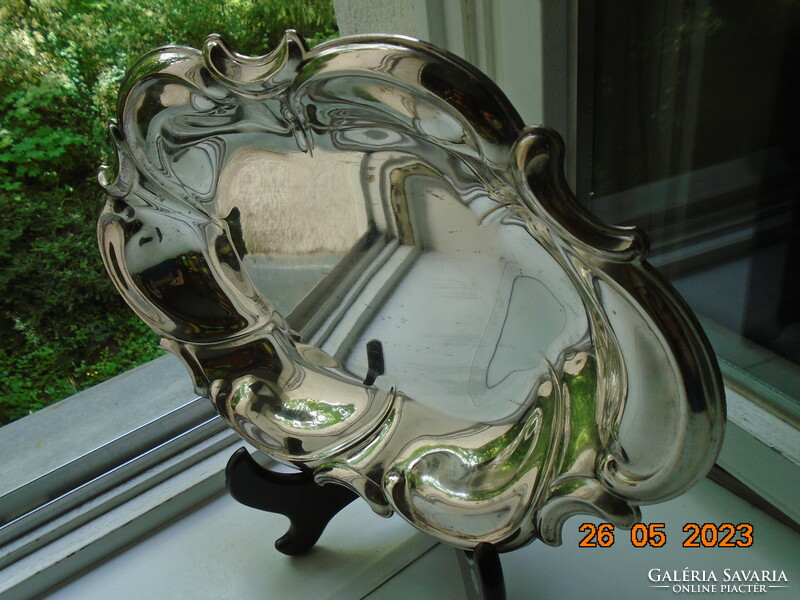 Spectacular mirror-bright silver-plated oval marked baroque serving bowl with wavy rim