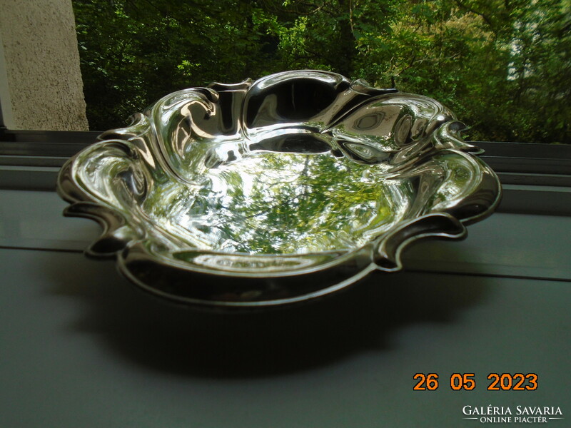 Spectacular mirror-bright silver-plated oval marked baroque serving bowl with wavy rim