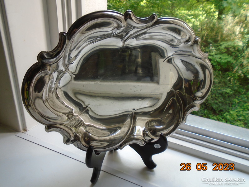 Spectacular mirror-bright silver-plated oval marked baroque serving bowl with wavy rim