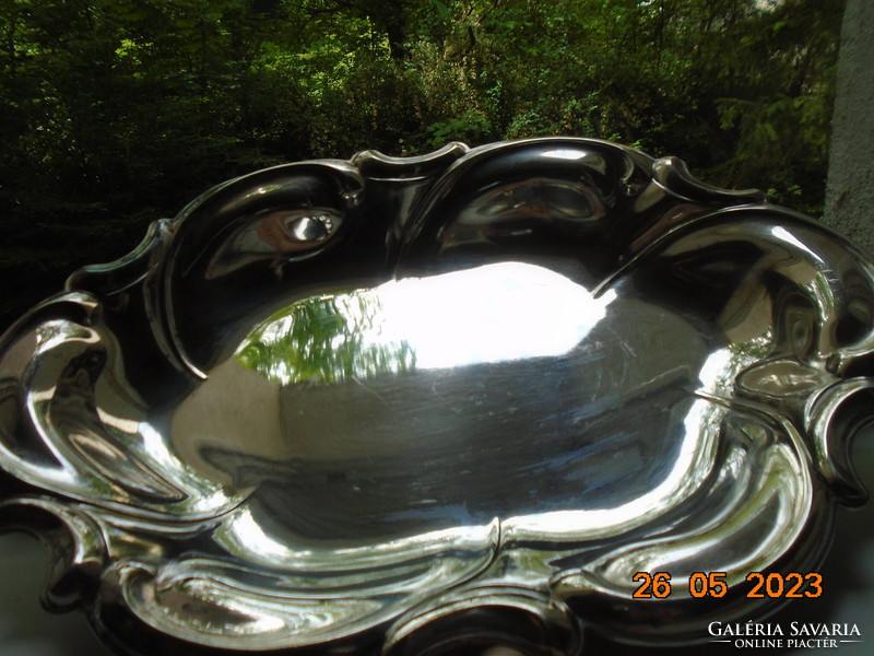 Spectacular mirror-bright silver-plated oval marked baroque serving bowl with wavy rim