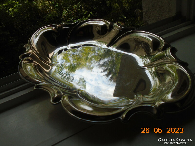 Spectacular mirror-bright silver-plated oval marked baroque serving bowl with wavy rim