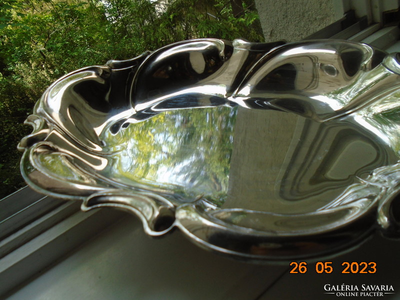 Spectacular mirror-bright silver-plated oval marked baroque serving bowl with wavy rim